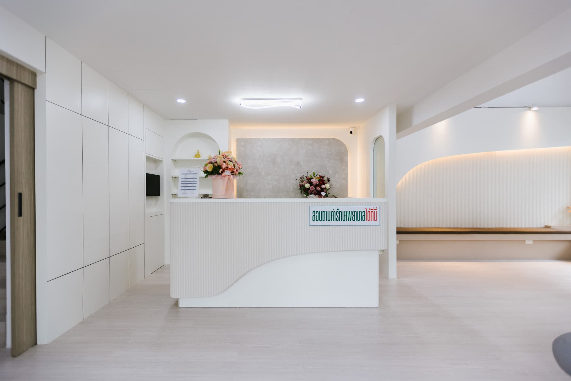 Reception desk with flower arrangements