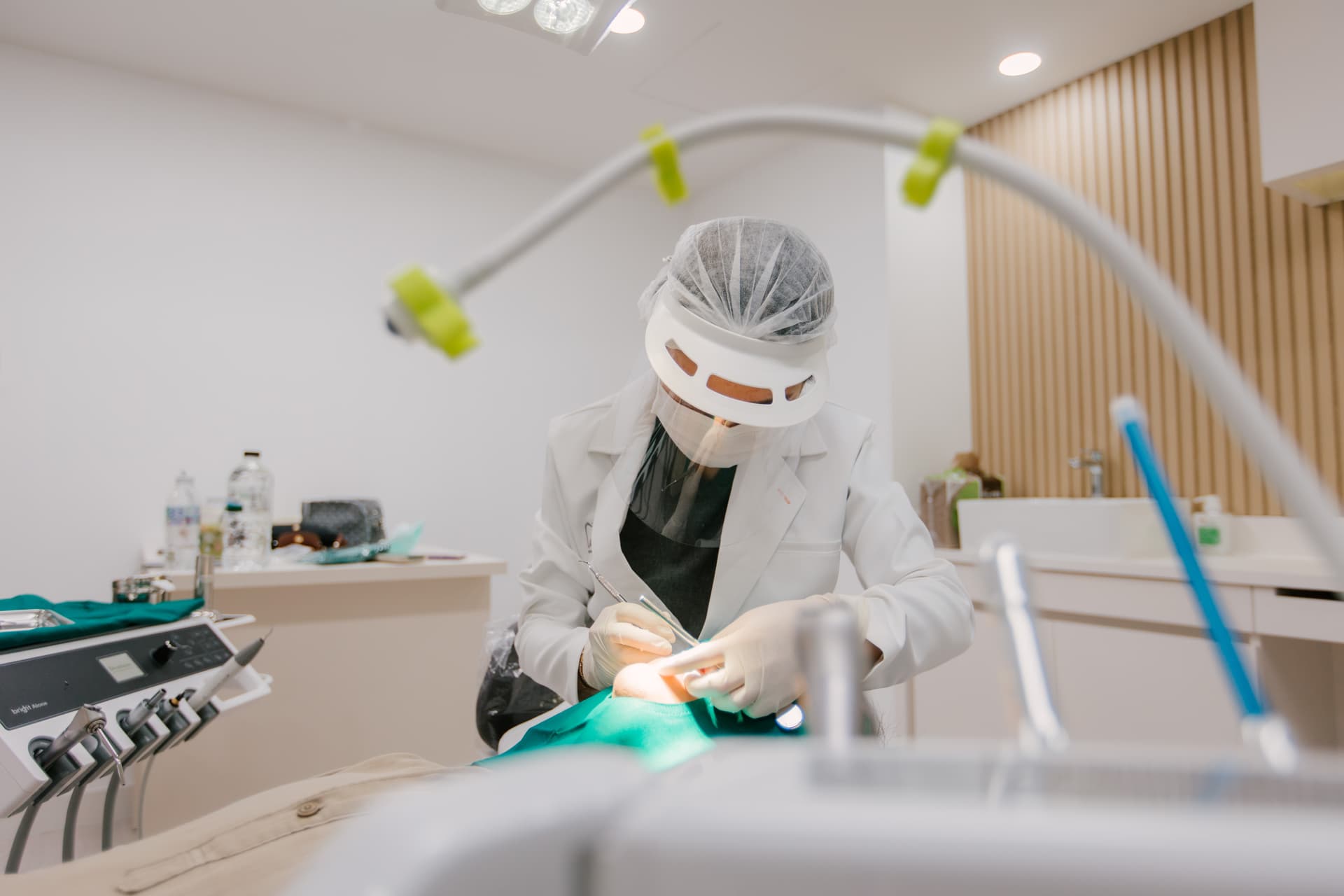 Doctor and assistant treating patient