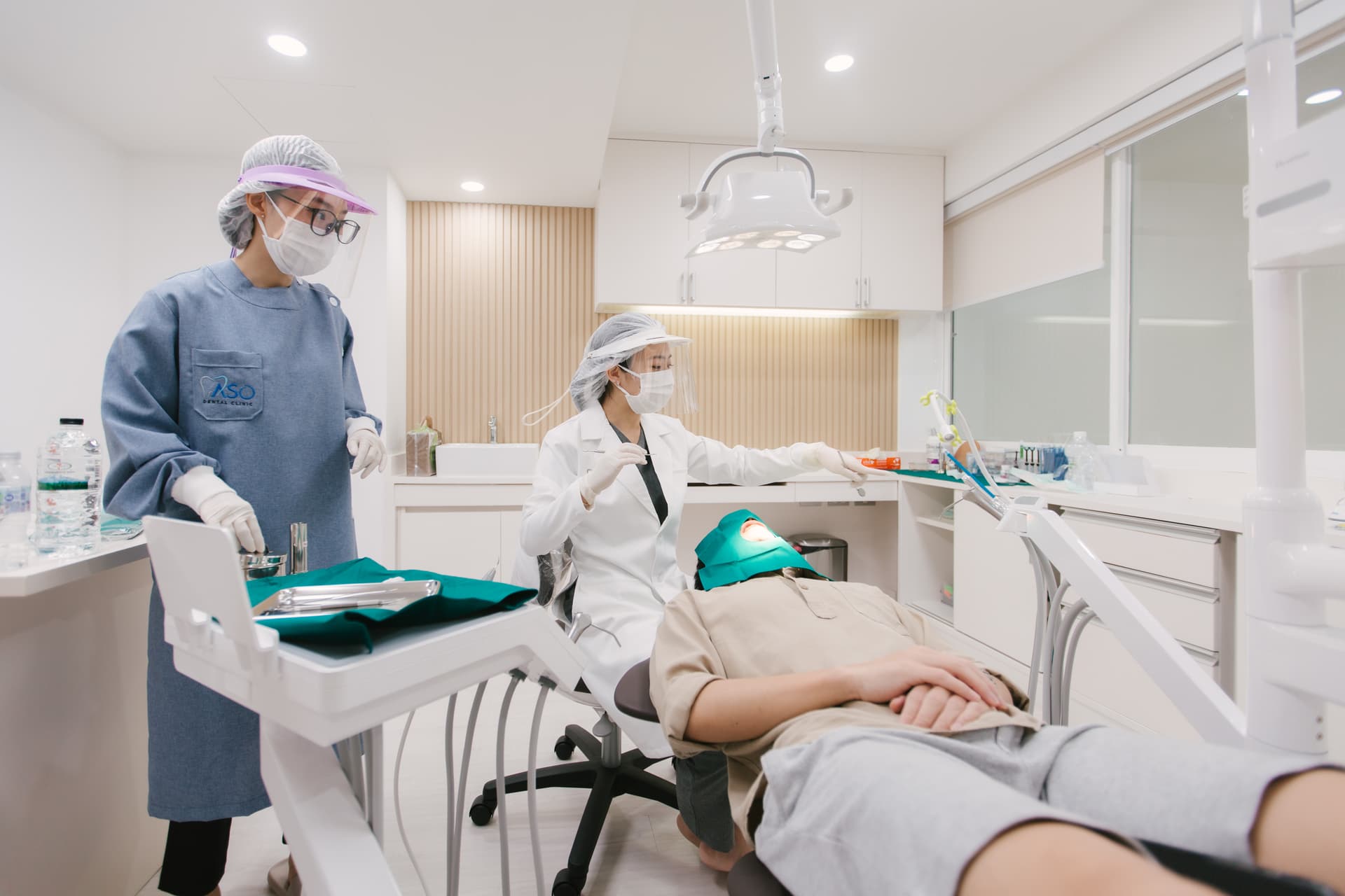 Dental team performing treatment close-up