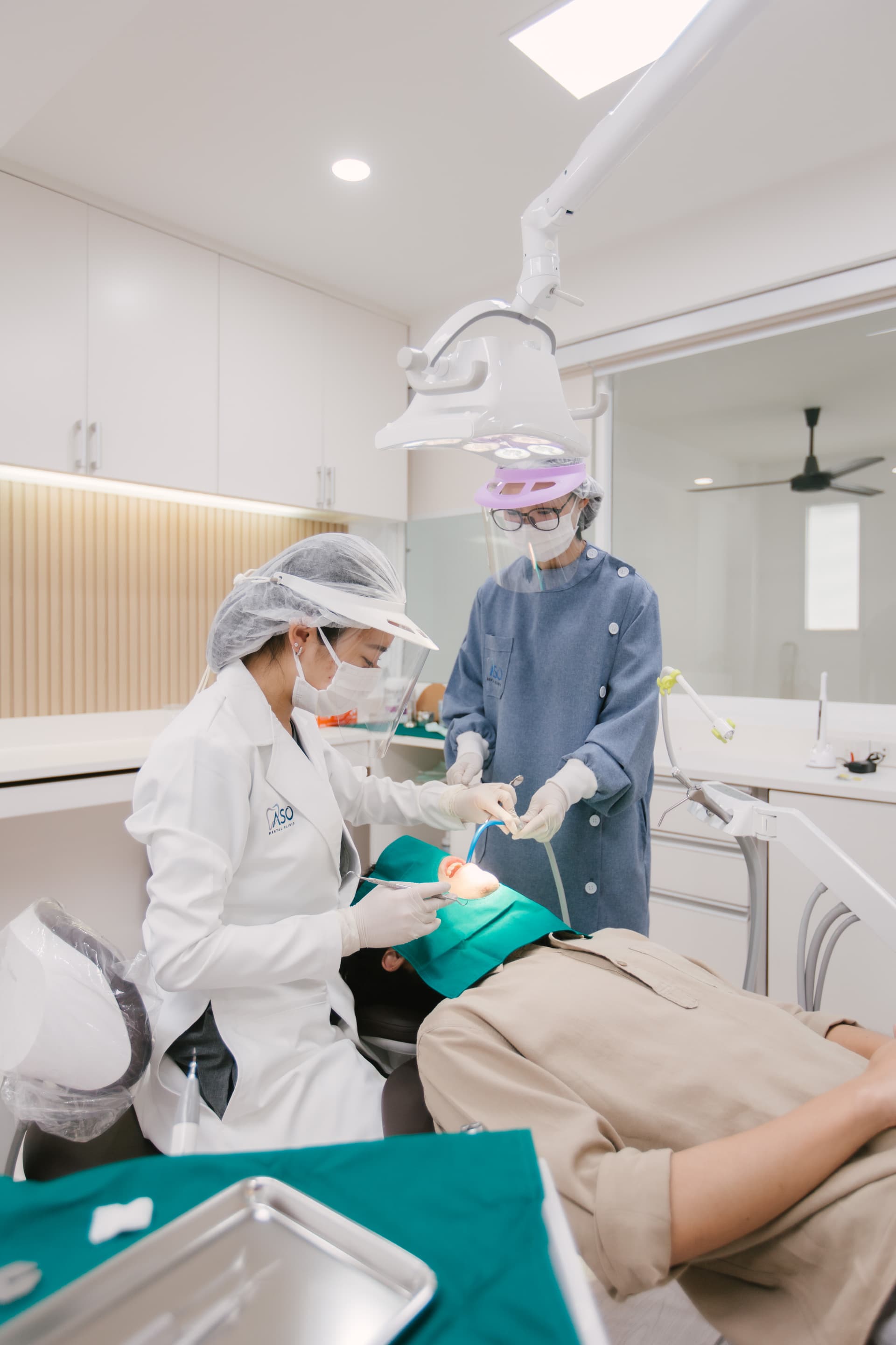 Doctor and assistant performing dental procedure