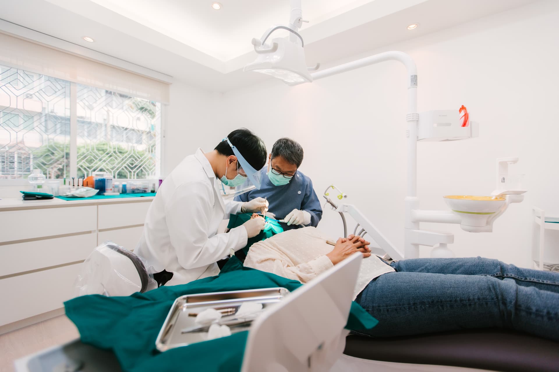 Dental team performing root canal treatment